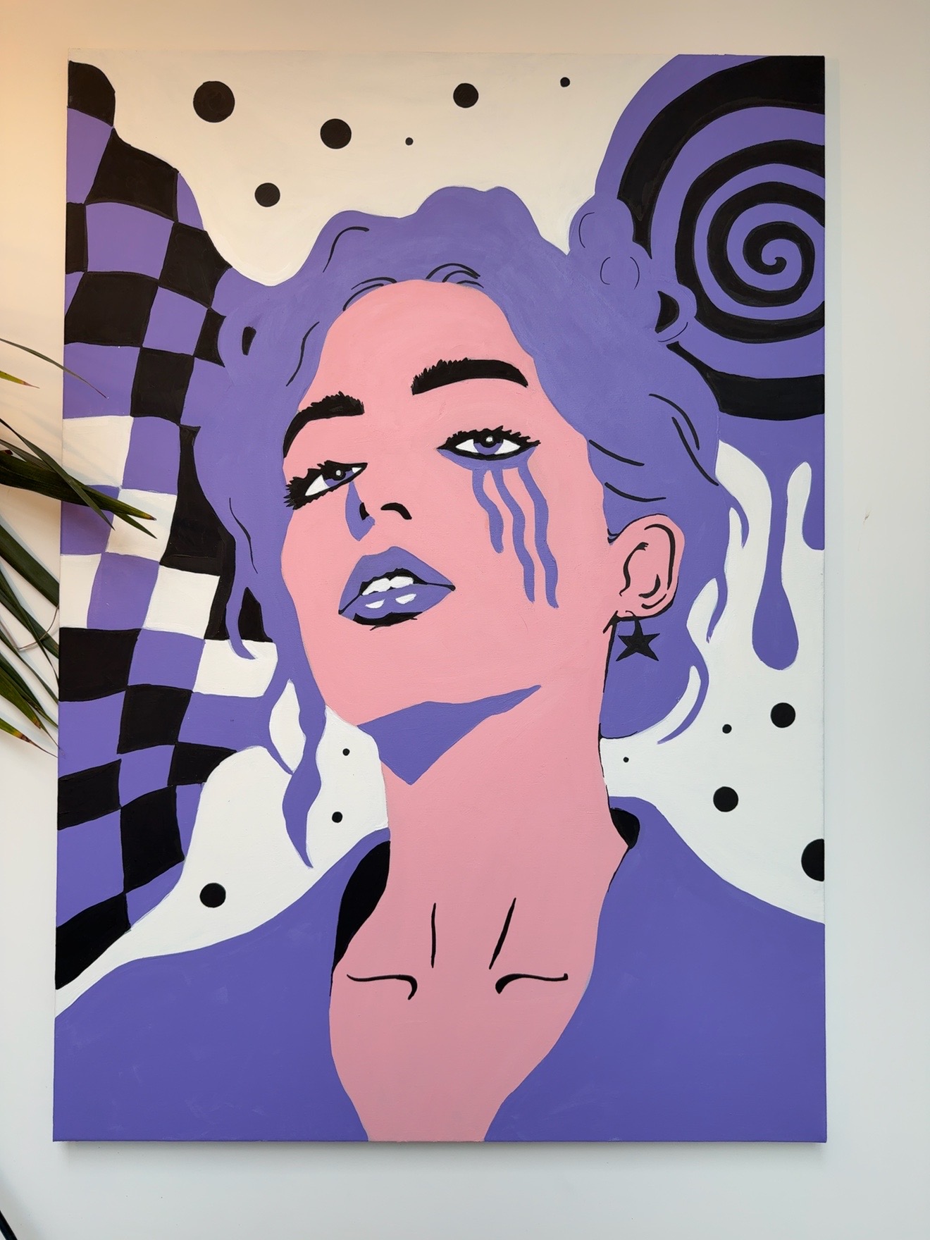 A pink and purple acrylic face with flowing purple tears and bold black shapes