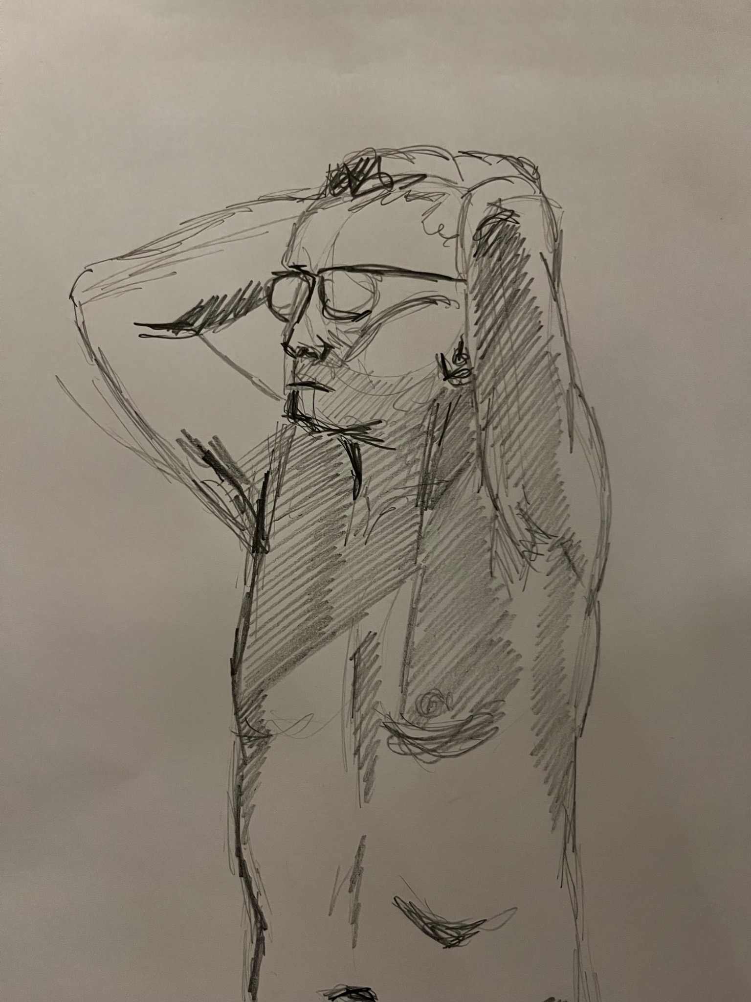 Pencil life drawing of a figure wearing glasses with arms raised behind the head